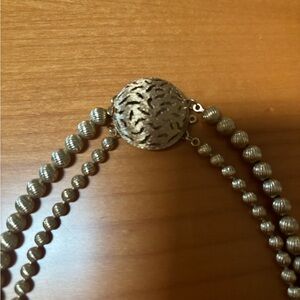 Stunning vintage double strand necklace fluted gold tone military ball bead.